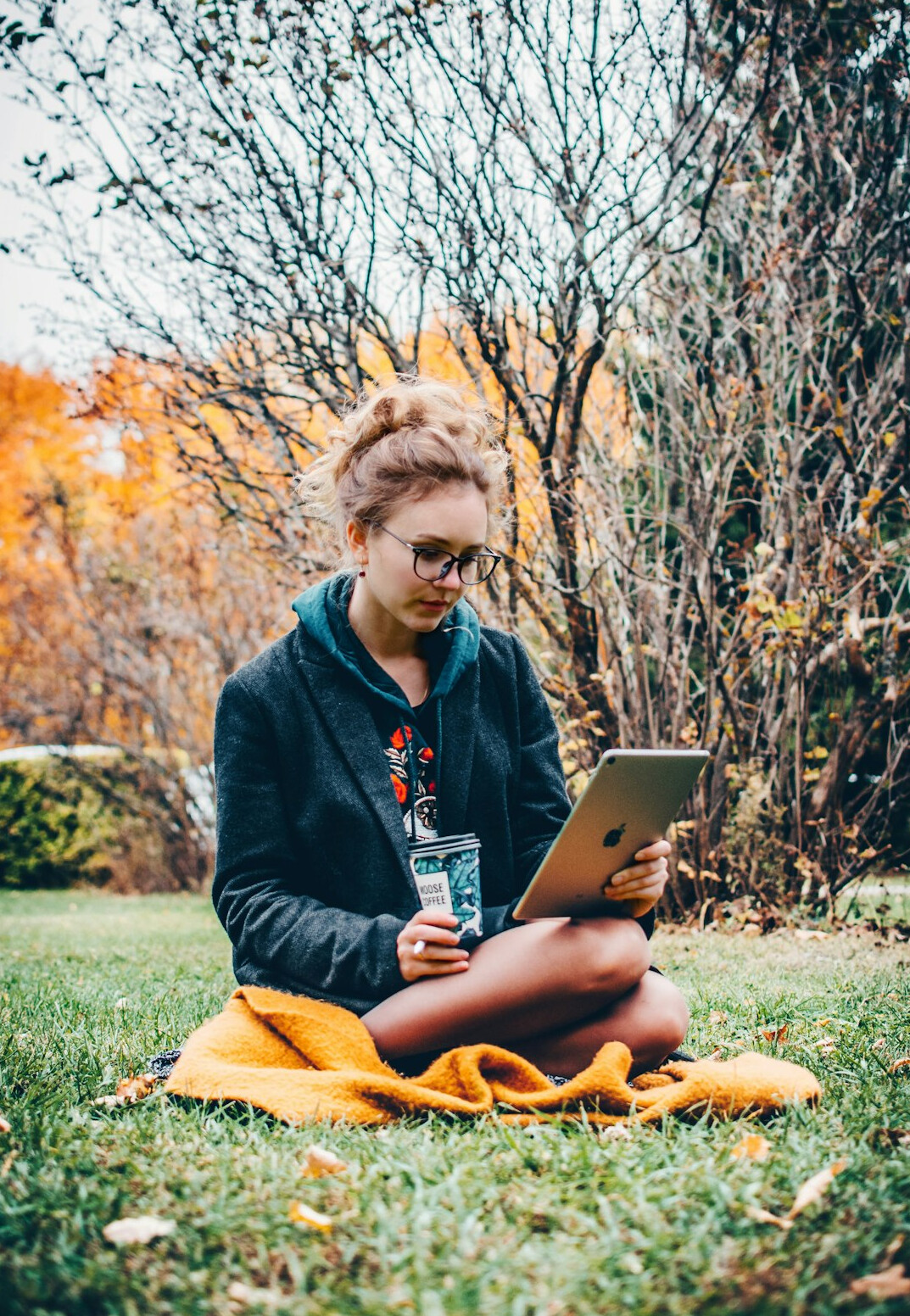 Portrait of a young Indian Singaporean woman studying code on a laptop